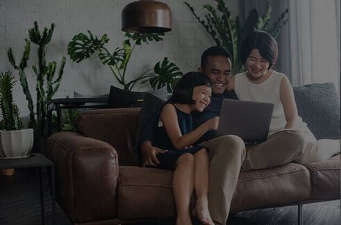 family sitting on a couch 